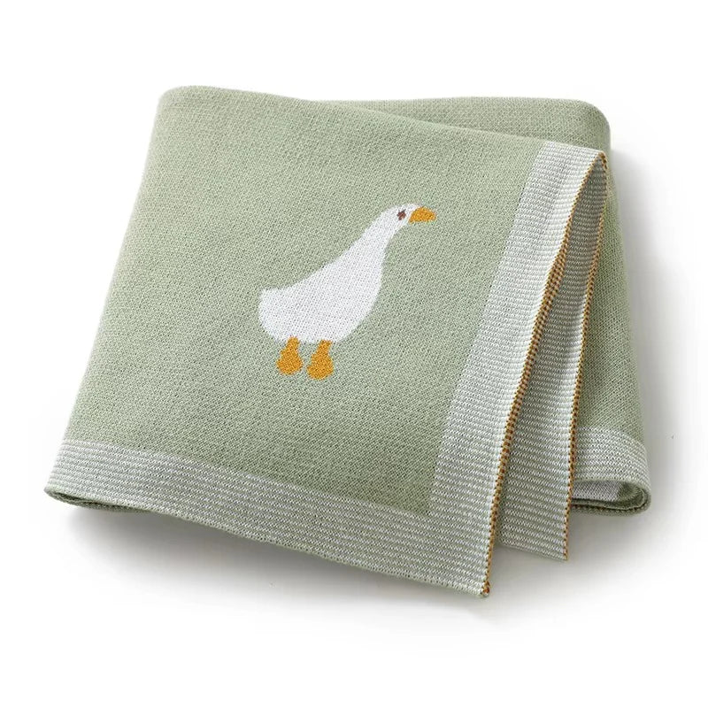 GESTRICKTE DECKE MIT GÄNSEMOTIV